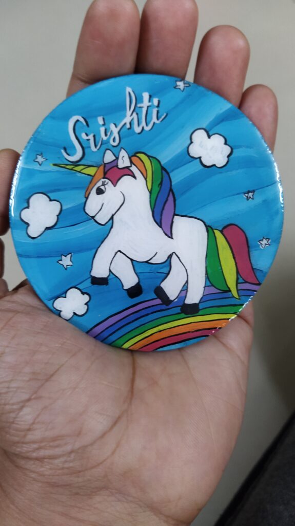 White Unicorn painted on fridge magnet with kids name.