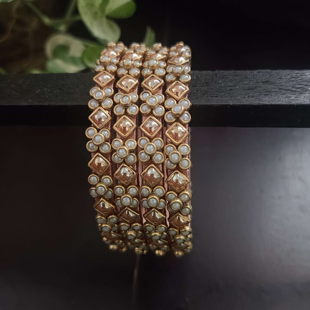 Pearl and gold kundan bangles